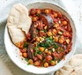 Aubergine & chickpea stew served in a bowl with flatbread