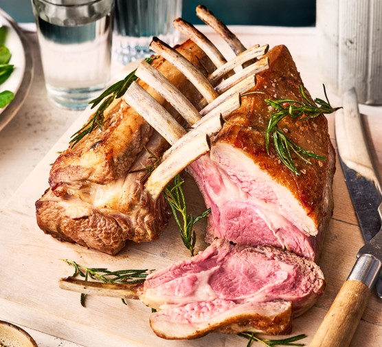 Roast rack of lamb Rack of lamb on board with slice cut